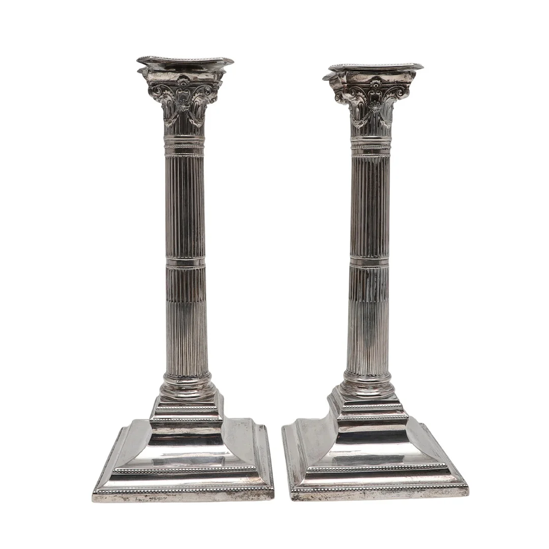 A PAIR OF VICTORIAN SILVER CANDLESTICKS. — Silver — Lawrences Auctioneers