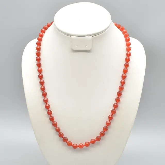 KARNEOL-PERLENCOLLIER, POLIERTE PERLEN, SILBERVERSCHLUSS AUS 835ER, UM 1950.