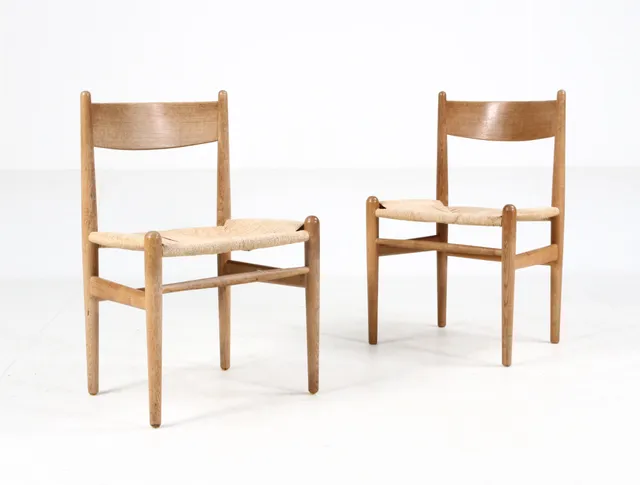 Hans J. Wegner for Carl Hansen & Søn: Two oak chairs with wicker, model CH36 (2)