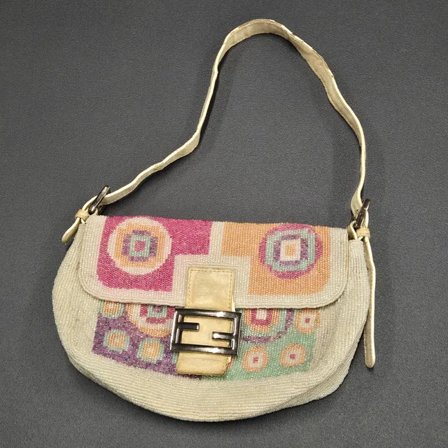 FENDI BAGUETTE BEADED HAND BAG.