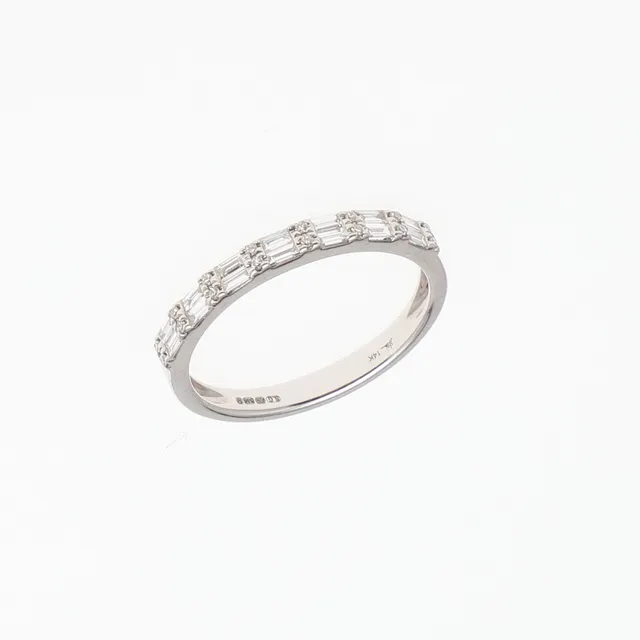 A DIAMOND HALF HOOP RING.