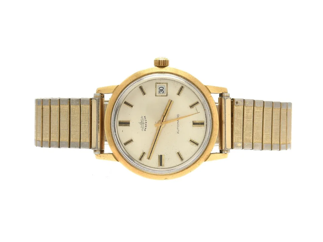 Perfecta, 18K, automat (defekt urverk), 36mm, datum, flexband, plexiglas, graverad, bucklor i boet — Klockor/Perfecta — Kaplans