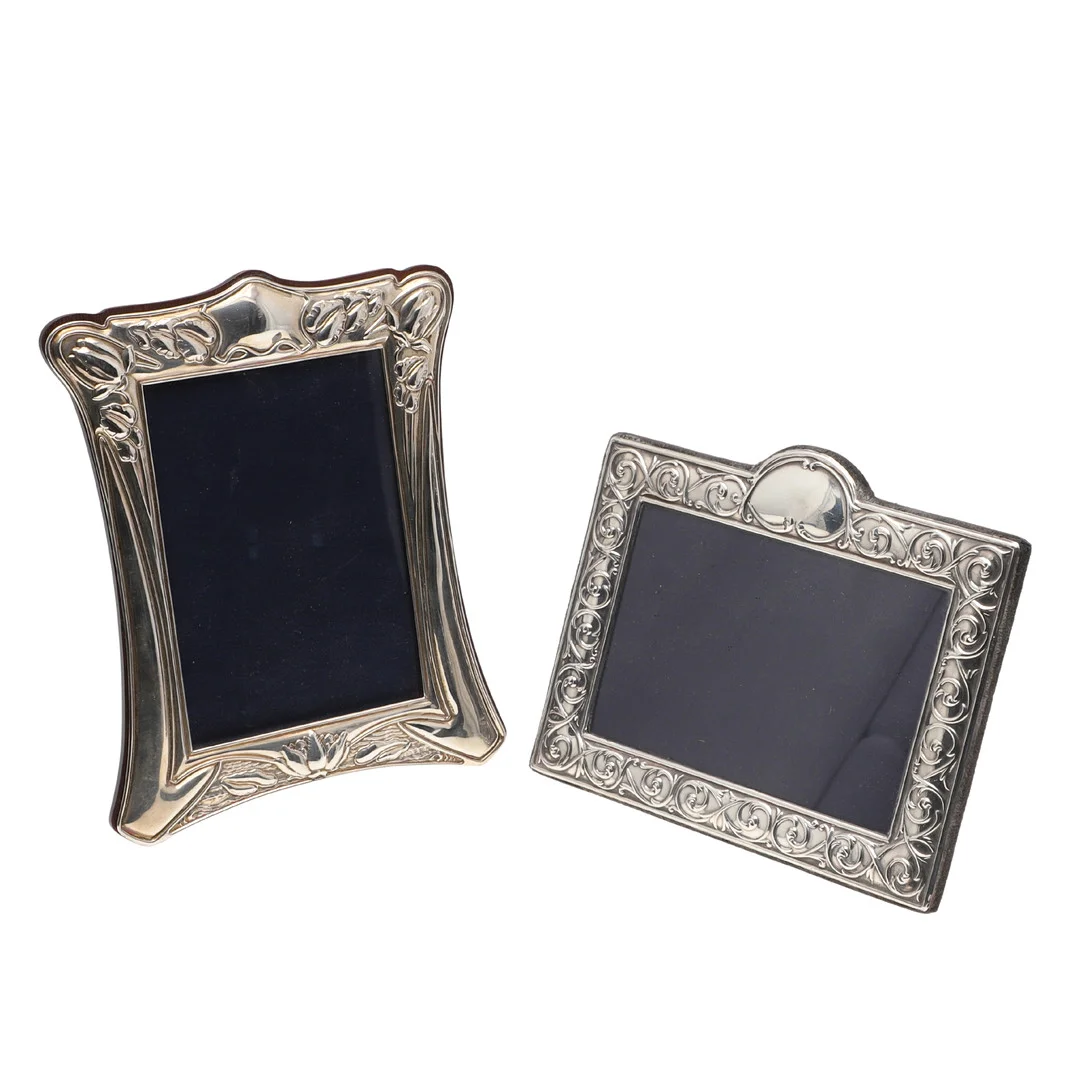 TWO SILVER FRONTED PHOTO FRAMES. — Silver — Lawrences Auctioneers