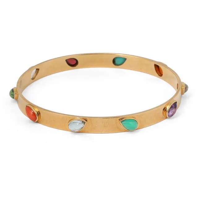 A bangle set with numerous pear-shaped gemstones, including amethyst, citrine, moonstone, garnet, peridote, green agate, coral and turquoise, mounted in 18k gold. Weight app. 24 g. W. 6 mm. Inner diam. app. 6.2 cm.