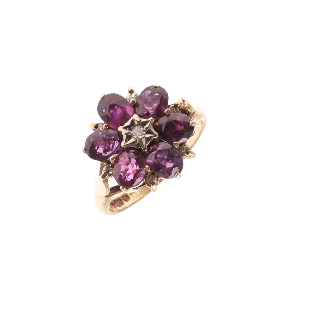 A GARNET AND DIAMOND CLUSTER RING. — Rings — Lawrences Auctioneers