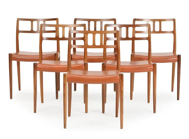 A set of six chairs with rosewood frame. Seat upholstered with artificial leather. Model 79. Designed 1966. Manufactured and marked by J. L. Møller. (6)