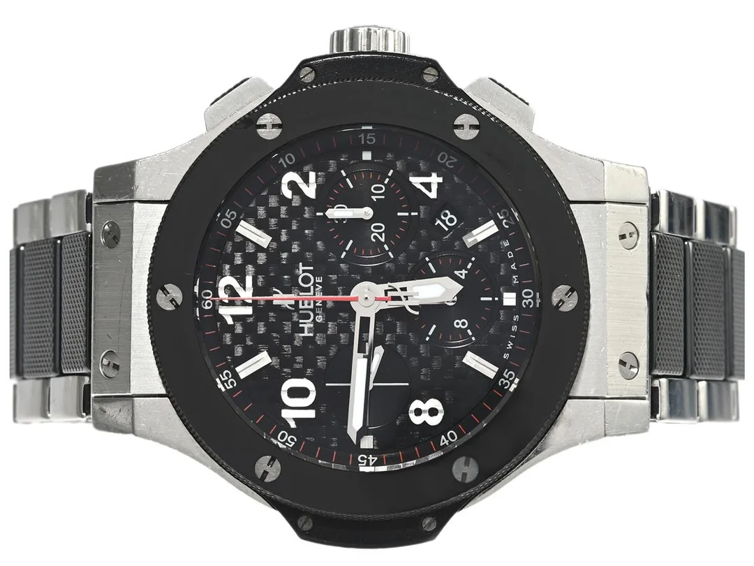 HUBLOT, Geneve, Big Bang, Cal HUB (ETA 7750), Serie nr. 751176, Ref nr. 301.SB.131.RX, Boett nr. 301, kronograf, herrur, 44 mm, stål/ceramic, automatisk, safirglas, datum, OBS: keramisk glasring (nagg, se bild), glasbaksida, gummiband, integrerad originallänk (stål/ceramic), viklås, cert (ej ifyllt), ca 2009, box, ytterkartong. — Klockor/Hublot — Kaplans
