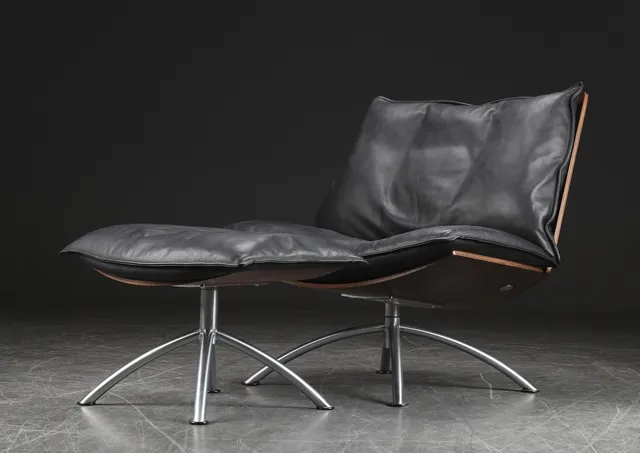 Tom Stepp. Lounge chair and footstool, Model 'Primetime', black leather (2)