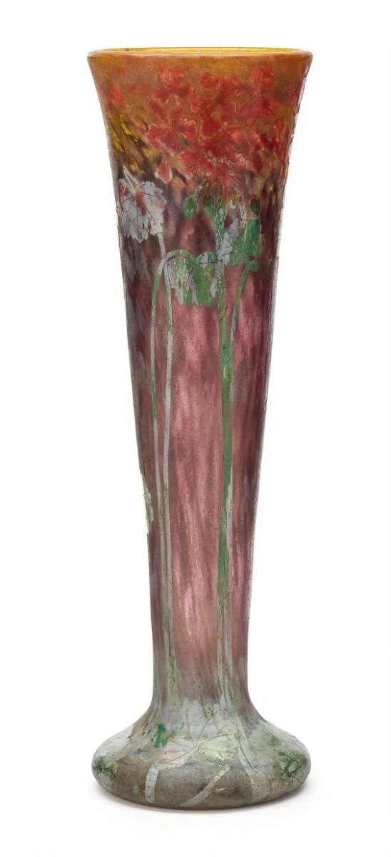 Tall vase of clear, red-purple and yellow glass with overlay of blue, green and red glass cut with flowers and leaves. Signed Daum Nancy. H. 50 cm. Diam. 15 cm. — Modern Decorative Art — Bruun Rasmussen