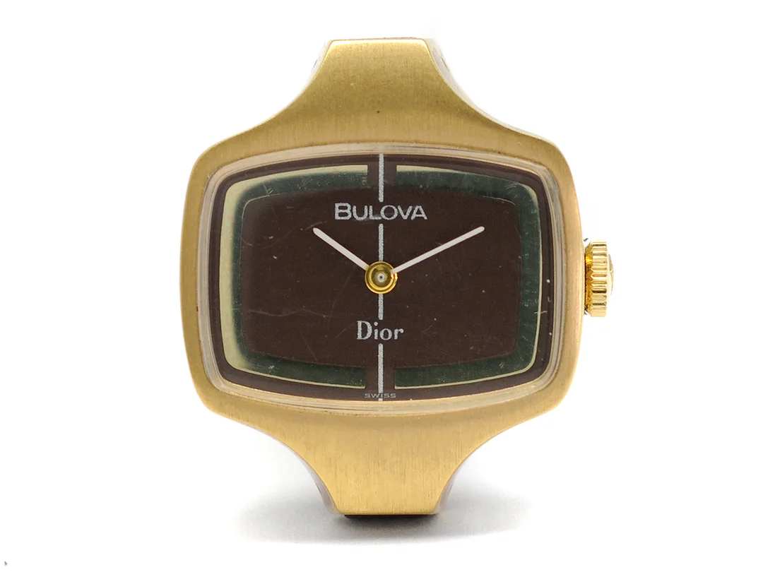 BULOVA, Dior, Cal 5 BD, Ref nr. AB 7216, Boett nr. 2-579493, damur, 23,5 x 27,5 mm, doublé, manuell, plexiglas, skadad urtavla (9/10), läderband, originalspänne i doublé, ca 1972. — Klockor/Bulova — Kaplans