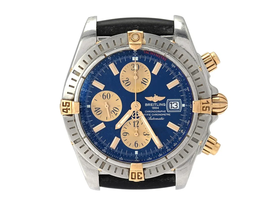 BREITLING, Chronomat Evolution, "Tachymetre", Chronometre, Cal B13, Verk nr. 2200484, Serie nr. 2200484, Ref nr. B13356, Boett nr. 4706B4, kronograf (knapp skadad), herrur, 43,7 mm, bicolour, automatisk, safirglas, datum, defekt (akut servicebehov), gummiband (Diver Pro 3), originalspänne, ca 2006. — Klockor/Breitling — Kaplans