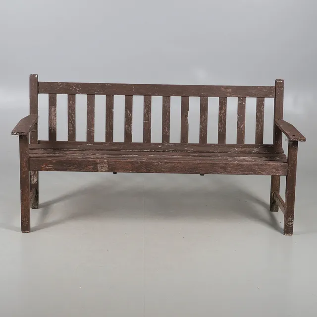 A PAINTED GARDEN BENCH.