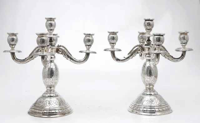 Pair of engraved silver candelabra, 20th Century.