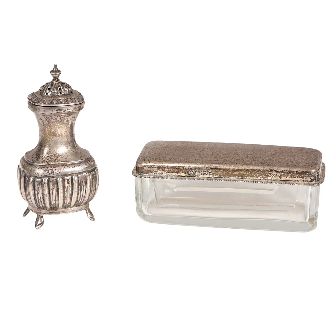A SILVER PEPPERETTE, A SILVER LIDDED DRESSING TABLE POT (2). — Silver — Bishop & Miller