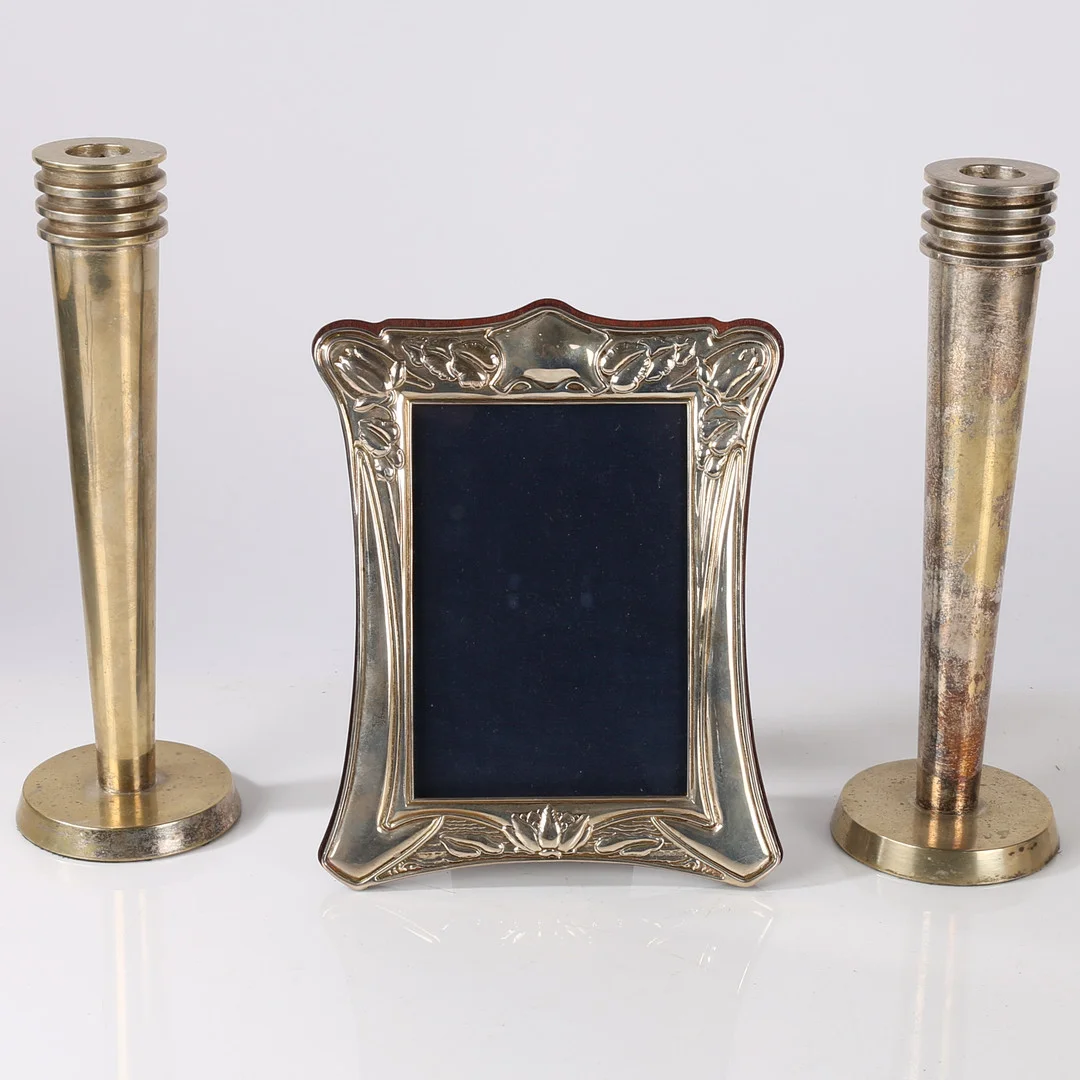 AN ELIZABETH II SILVER PHOTO FRAME, A PAIR OF JUGENDSTIL STYLE CANDLESTICKS (3). — Silver — Bishop & Miller