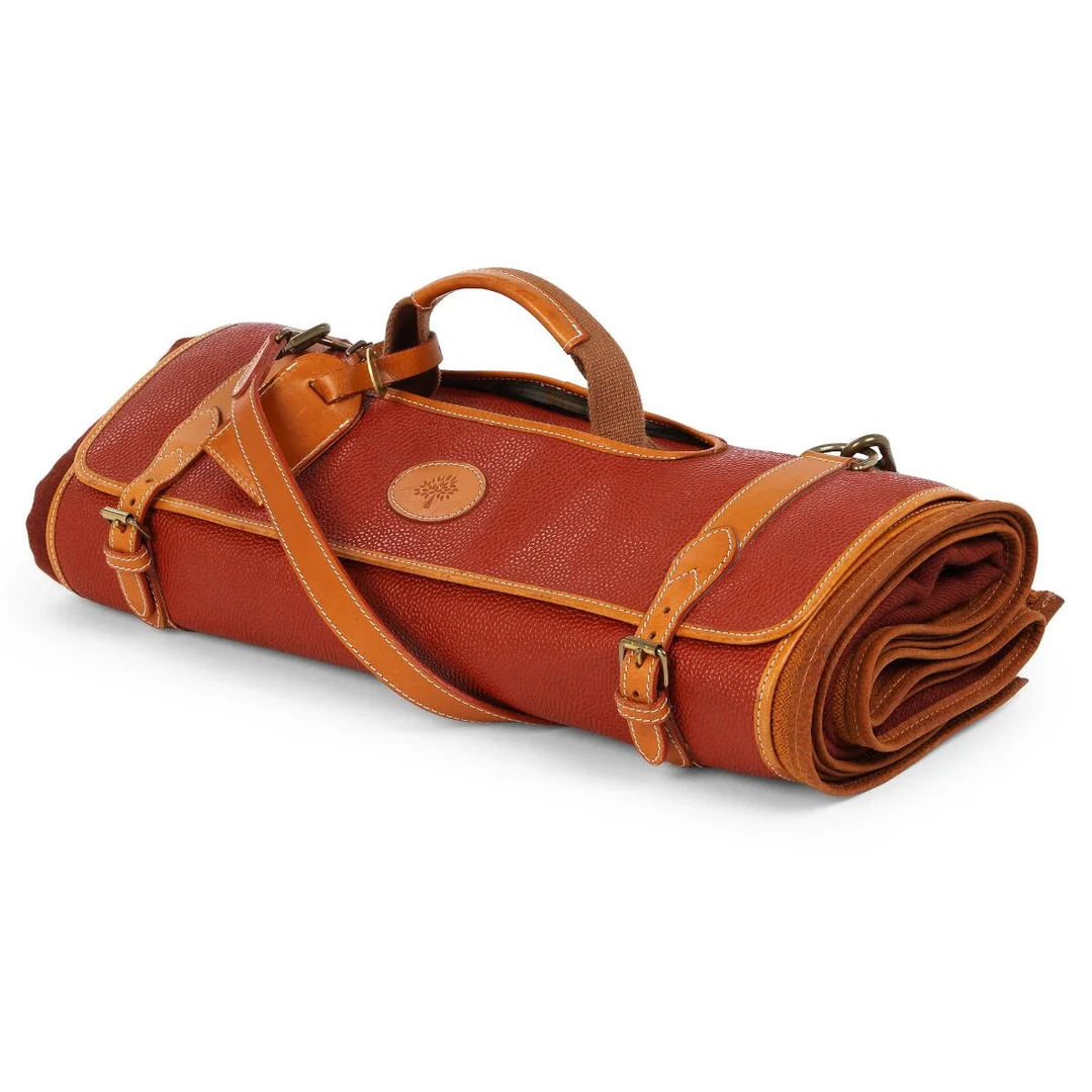 A two toned brown plaid in a matching case of brown leather and coated canvas with gold tone hardware, short handle and detachable and adjustable shoulder strap. Accompanied by name tag. Bag L. app. 42 cm. (2) — Designer Handbags & Fashion — Bruun Rasmussen