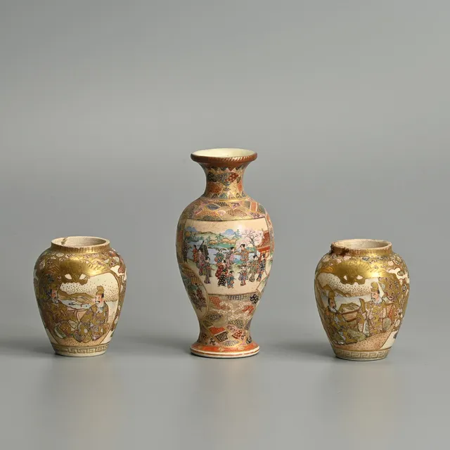 A JAPANESE SATSUMA MINIATURE OVIFORM VASE AND A PAIR OF MINIATURE VASES, ALL MEIJI PERIOD.