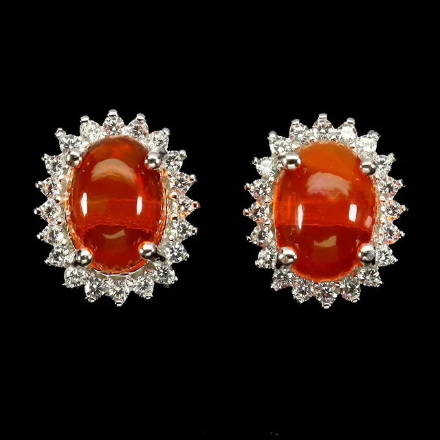 Earrings in rhodium-plated Sterling silver adorned with fire opals, surrounded by white cubic zirconias