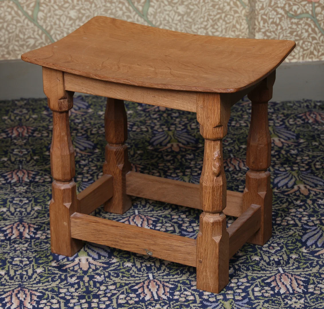 A ROBERT "MOUSEMAN" THOMPSON OAK STOOL. — Tables — Bishop & Miller
