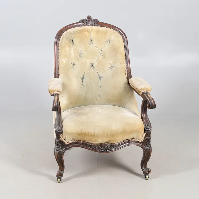 A 19TH CENTURY CARVED MAHOGANY SHOWFRAME OPEN ARM CHAIR.