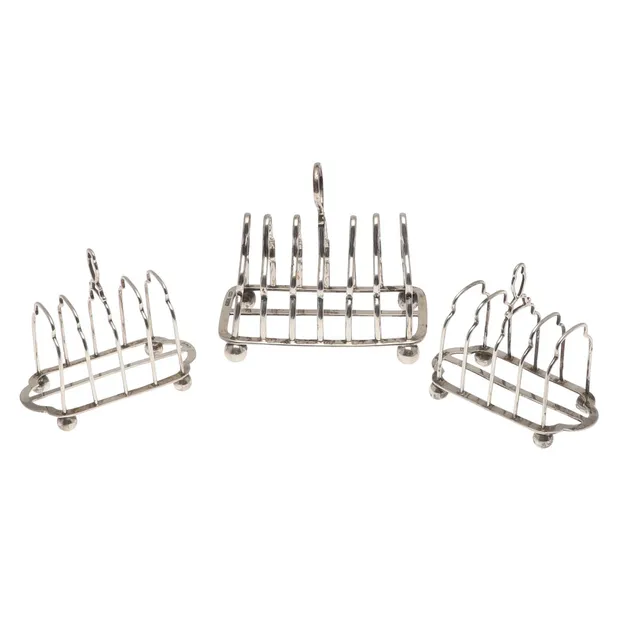 A PAIR OF SILVER TOAST RACKS AND ANOTHER.