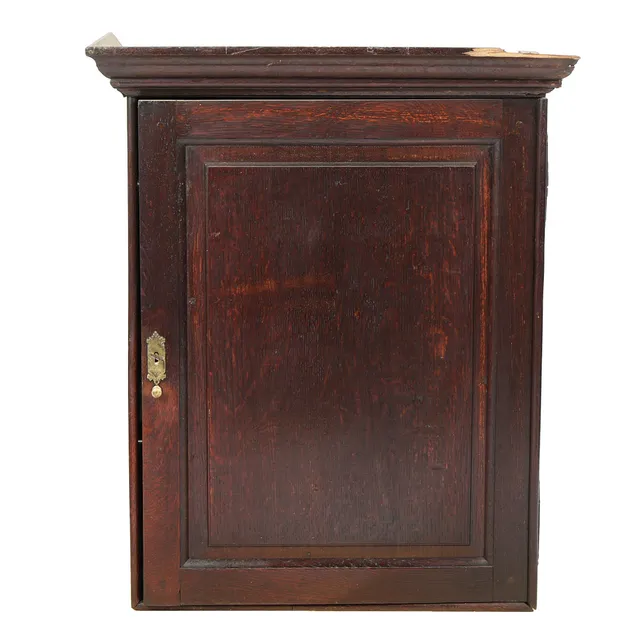 A GEORGE III OAK HANGING CUPBOARD, CIRCA 1800.