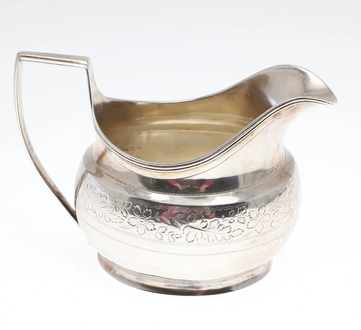 A GEORGE III SILVER CREAM JUG. — Silver — Lawrences Auctioneers