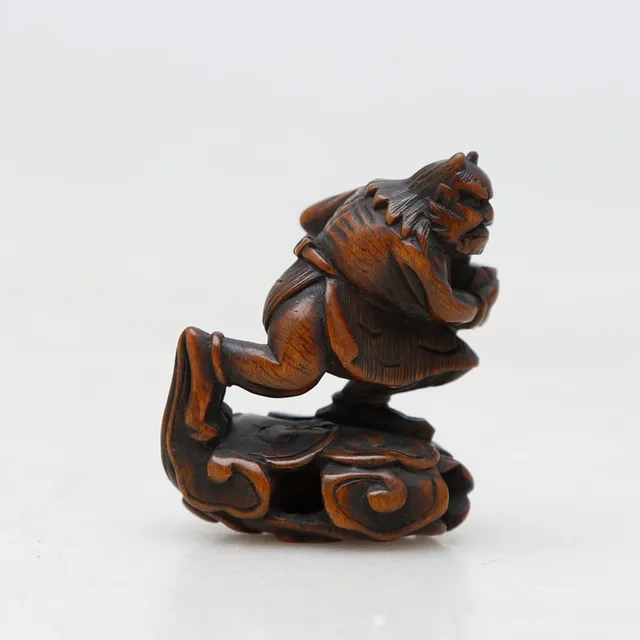 JAPANESE SCHOOL FROM THE EDO PERIOD, 19TH CENTURY. Oni carrying a relic.