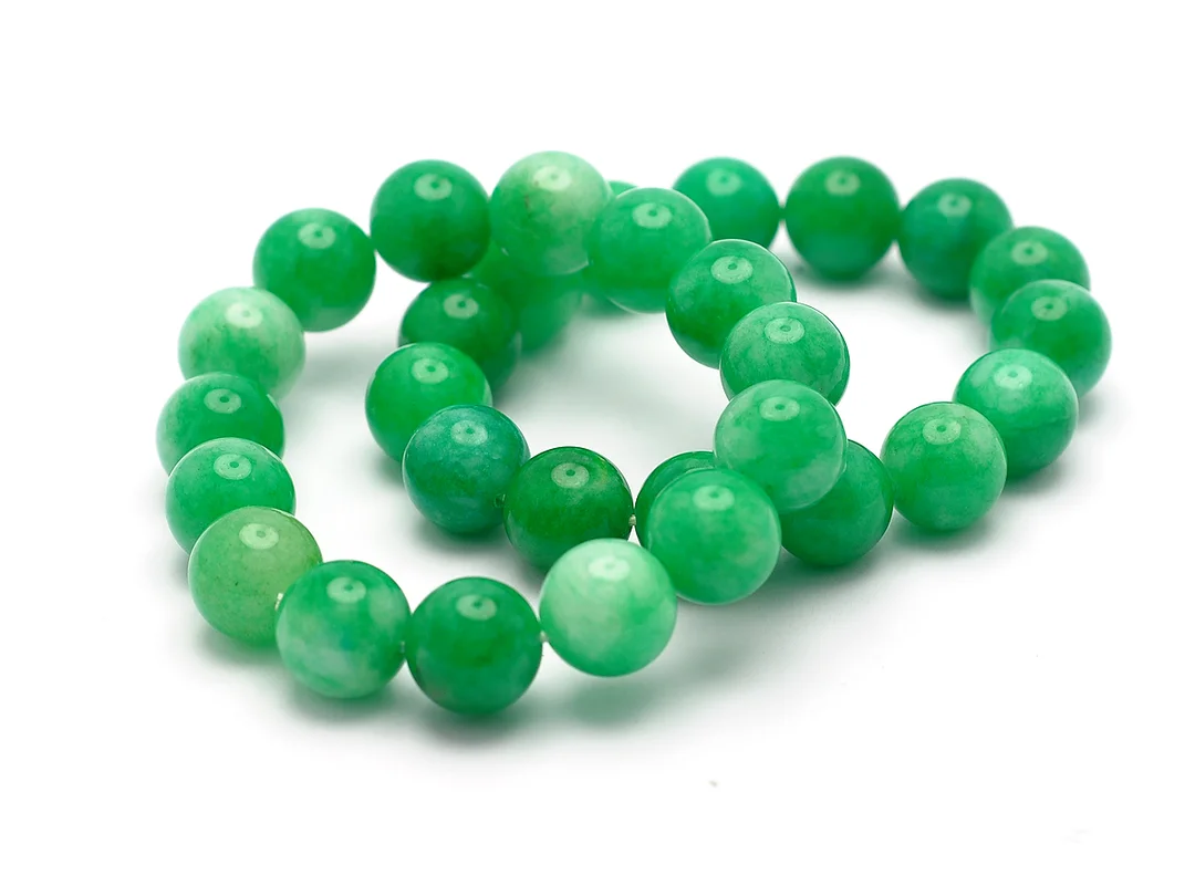 ARMBAND, 2 ST, grönfärgad kvarts, ca 14 mm, vikt 111,1 g, elastiska. — Smycken/Armband — Kaplans