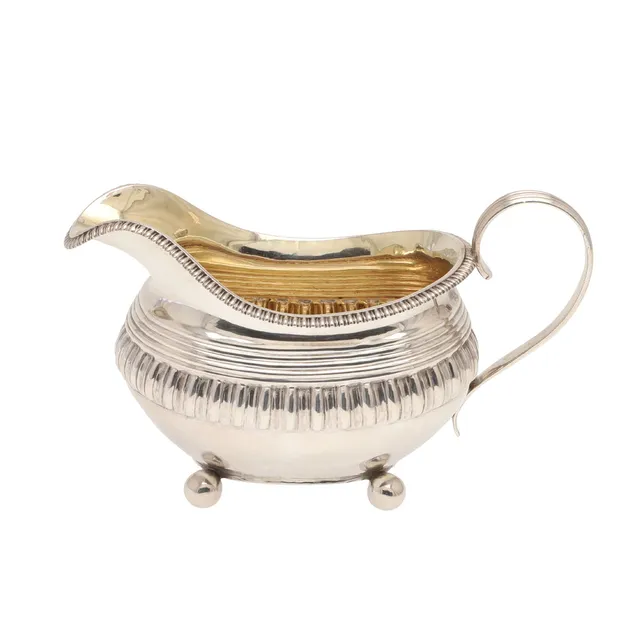A LARGE GEORGE III SILVER CREAM JUG.