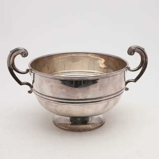 A MODERN TWO-HANDLED CUP.