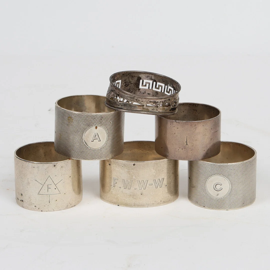 SIX SILVER NAPKIN RINGS (6). — Silver — Bishop & Miller