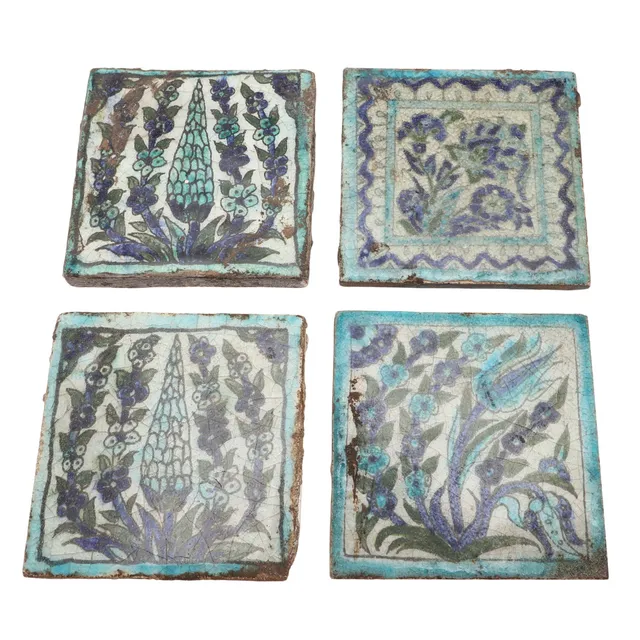 FOUR LATE 19TH/ EARLY 20TH CENTURY POTTERY TILES.