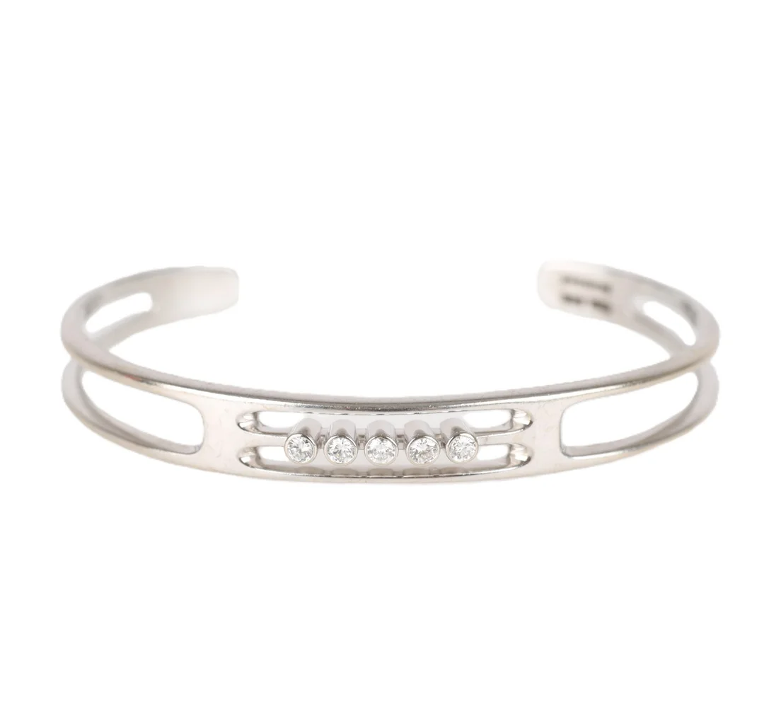 Sven Haugaard: A bangle of 14k white gold with diamonds, approx. 0.25 ct. — Jewellery/Bracelets — Lauritz
