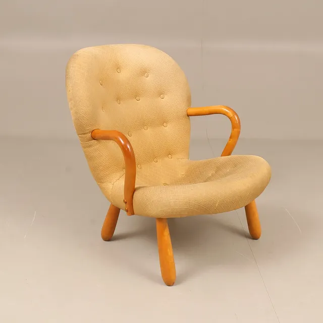 ARNOLD MADSEN. TILLSKRIVEN. Fåtölj, modell Muslinge-stol/Clam chair, omkring 1900-talets mitt.