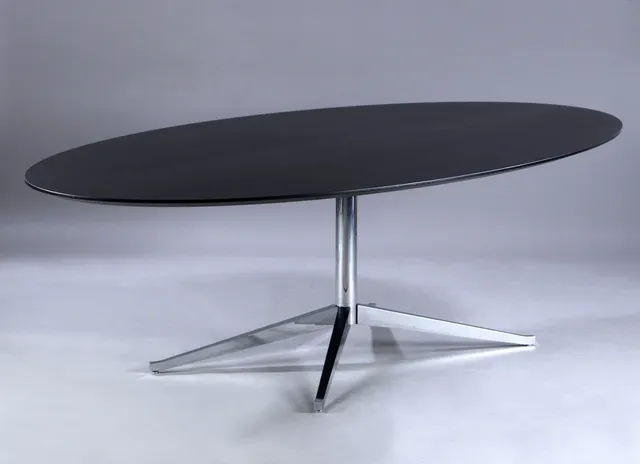 Florence Knoll. Dining table/conference table, oval top in black-glazed wood