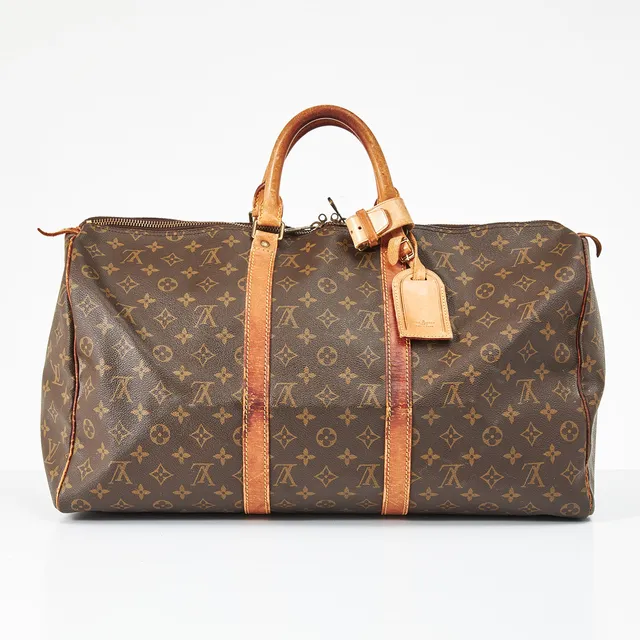 LOUIS VUITTON, "Keepall 50" weekendbag med monogrammönster, 1980-tal, cognacsfärgade skinndetaljer med tillhörande adressbricka, invändigt klädd med brun textil, märkt med datumkod.