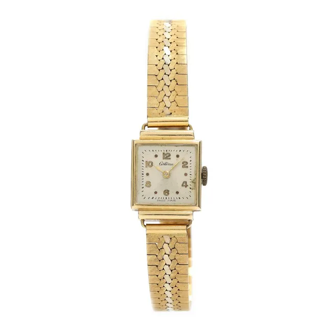 Wristwatch of 14k gold, ref. C086. Mechanical movement with manual winding. Bracelet of 18k gold and white gold. Circumference approximately 19.5 cm. Total weight app. 32 g. Ø 16 mm.