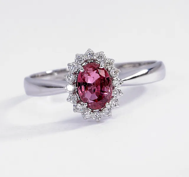 Ruby and diamond rosette ring in 18 kt. white gold