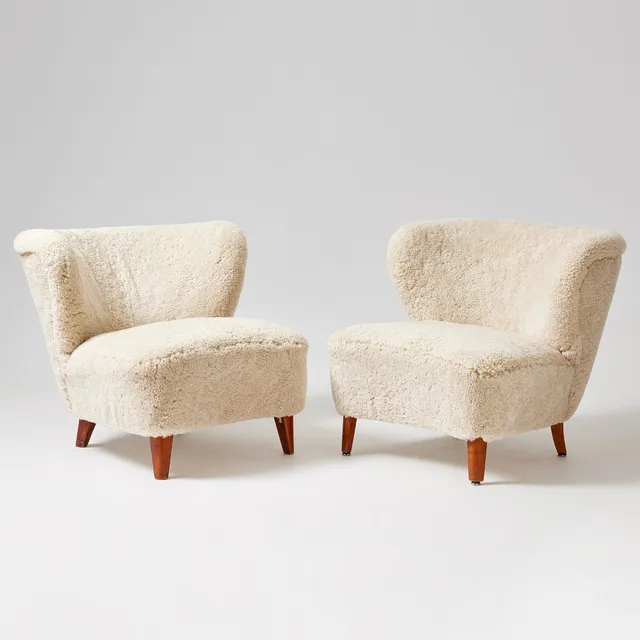 GÖSTA JONSSON. Two armchairs, Jönköping 1940s, Swedish Modern, legs in stained birch, sheepskin upholstery.