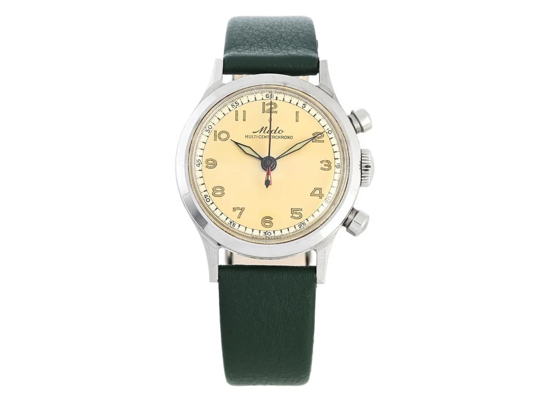 MIDO, Multi-Centerchrono, Cal 1300, Boett nr. 0945 / 1470945, kronograf, herrur, 34,5 mm, stål (Rustless Steel), manuell, plexiglas, innerlock, läderband, ca 1950. — Klockor/Mido — Kaplans
