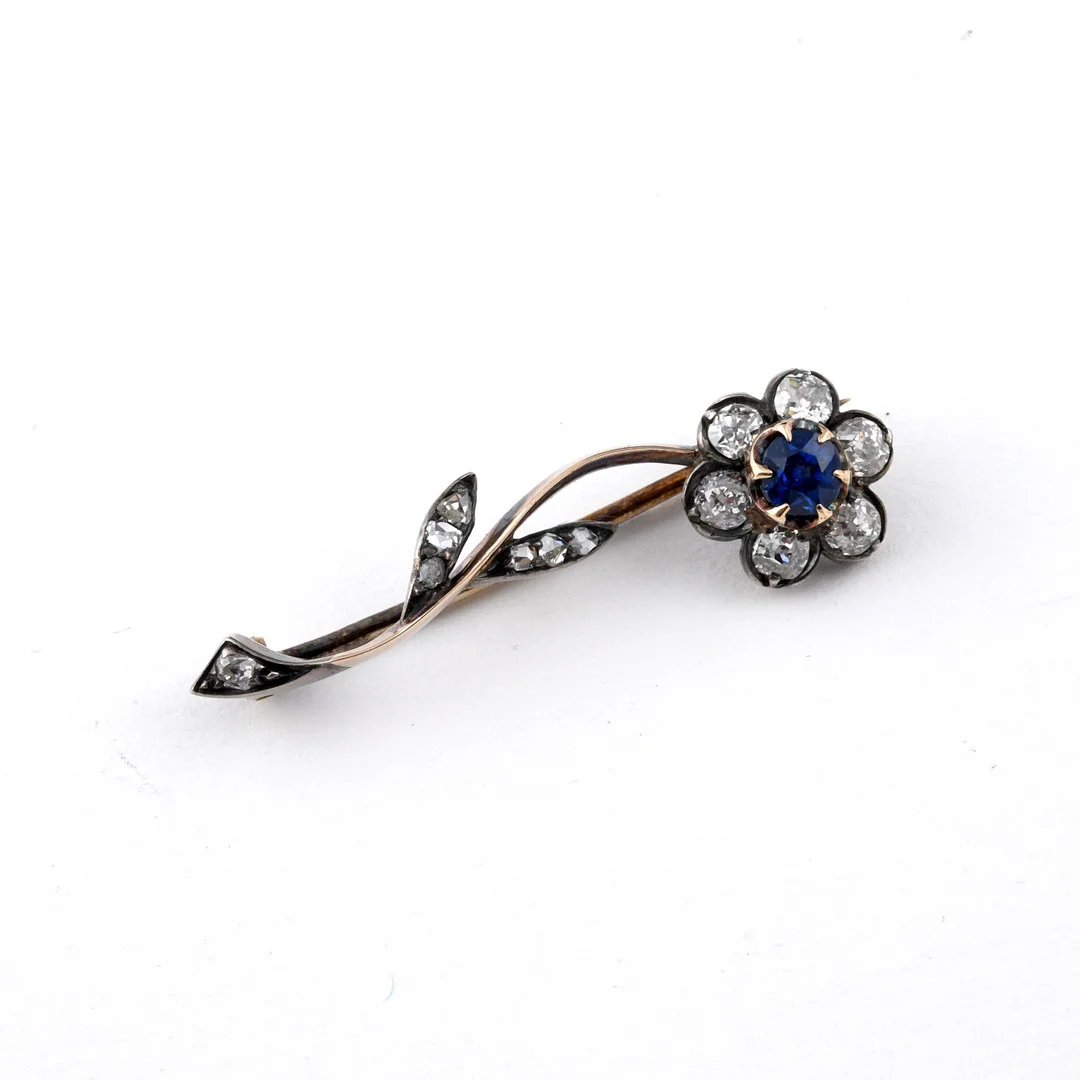 A SAPPHIRE AND DIAMOND FLOWER BROOCH. — Brooches & Pendants — Lawrences Auctioneers