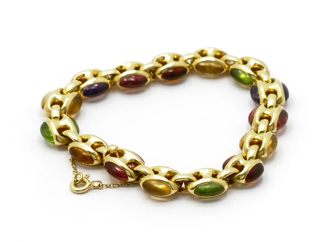 ARMBAND, 18K guld, cabochonslipade turmaliner, peridoter, ametister, citriner, granater, längd 18,2 cm, vikt 36,2 g, Italien, säkerhetskedja. — Smycken/Övriga — Kaplans