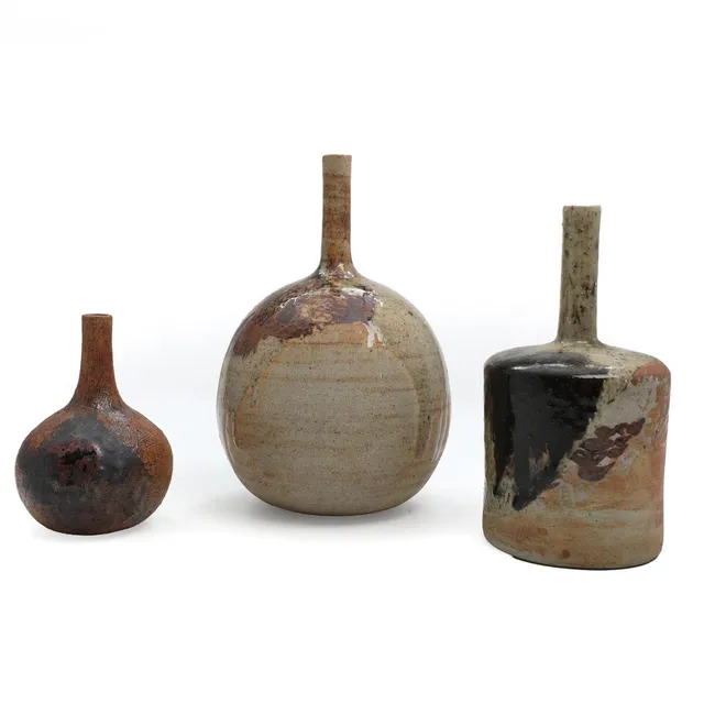 Three partially glazed stoneware vases. Stamped with monogram. H. 14.5–27 cm. (3)