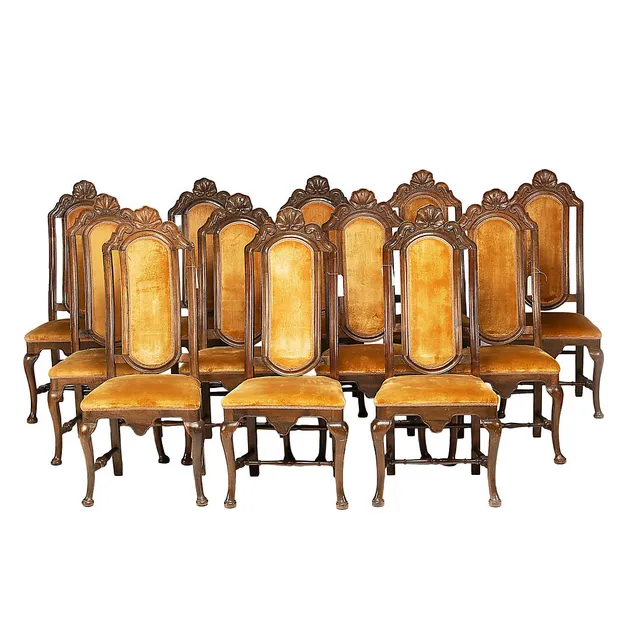 Set of twelve Spanish chairs of English style in carved walnut, mid 18th Century.