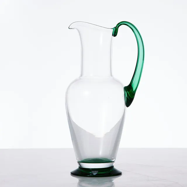 GUNNAR CYRÉN. KANNA, "Nobel", Orrefors, designår 1991, klarglas med grön fot och påklippt hänkel.