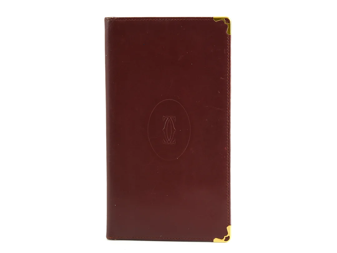 RESEPLÅNBOK; CARTIER, vintage, vinrött läder, 19x10cm, 6st kontokortsfack. — Accessoarer/Plånböcker — Kaplans