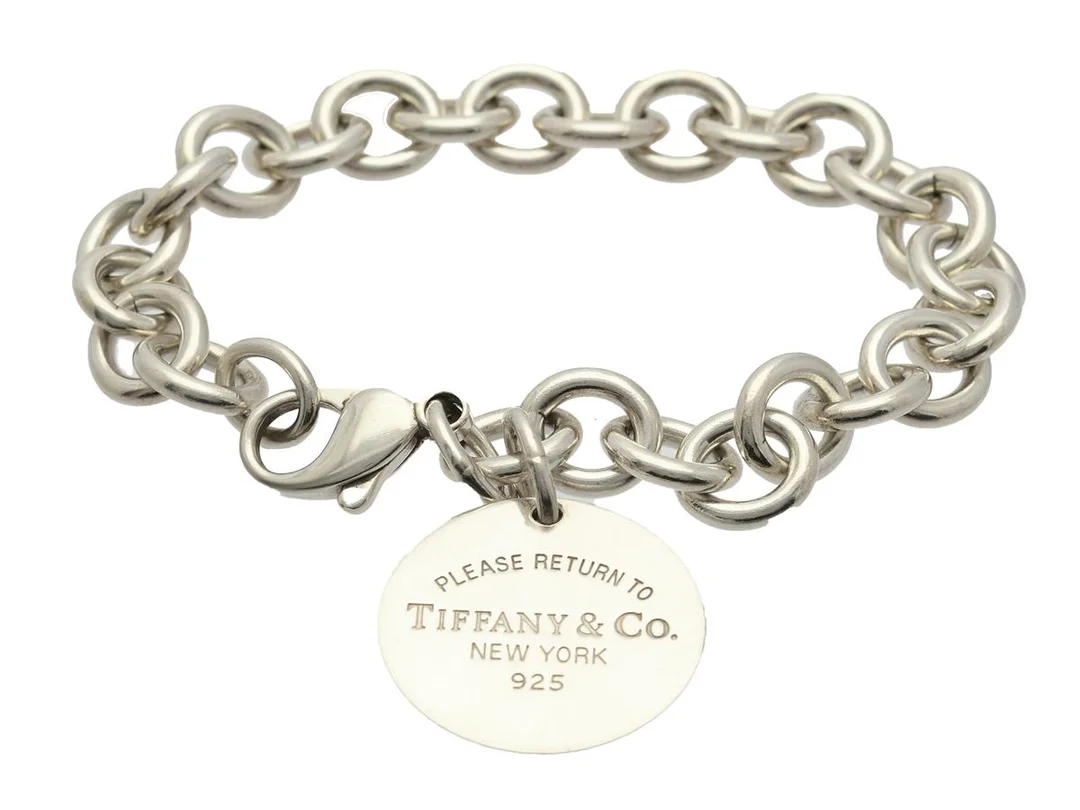 TIFFANY & CO, armband, Return to Tiffany, sterlingsilver, längd 19 cm, vikt 36,9 g, påse, originaletui. — Smycken/Armband — Kaplans