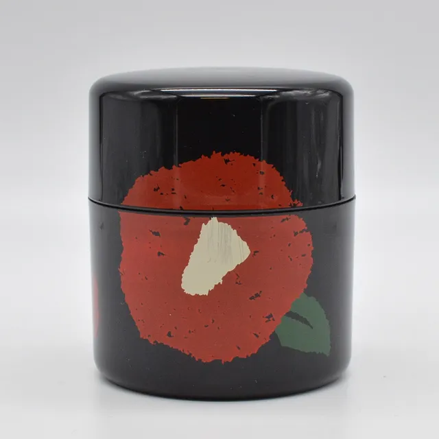 TATSUMIYA CO. TEEDOSE, KAMELIEN AUF SCHWARZ, KUNSTSTOFF, JAPAN, VINTAGE.