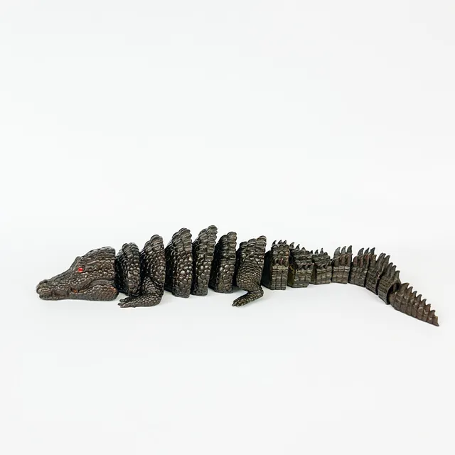 BRONZE ARTICULATED CROCODILE.
